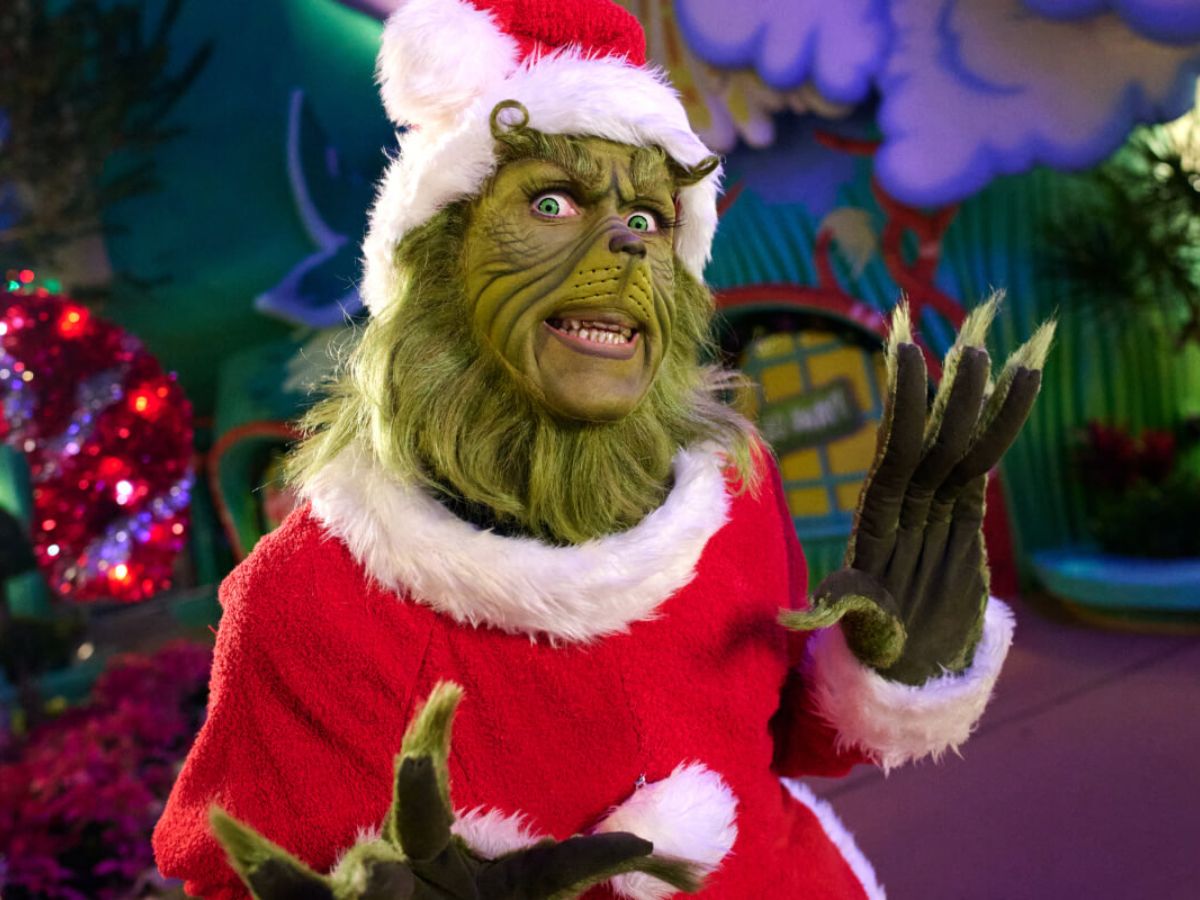 A tour guide leading guests through a holiday themed area at Universal Orlando