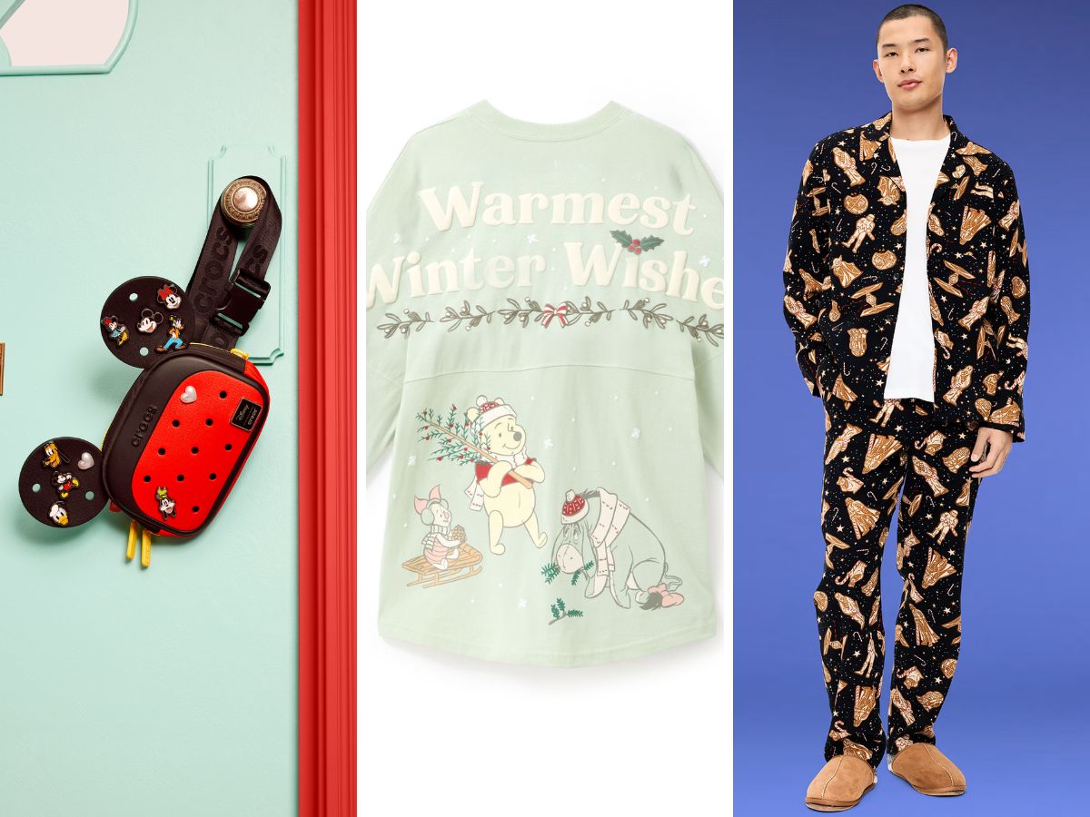 A collection of Disney apparel, Crocs, and accessories spread across a bed